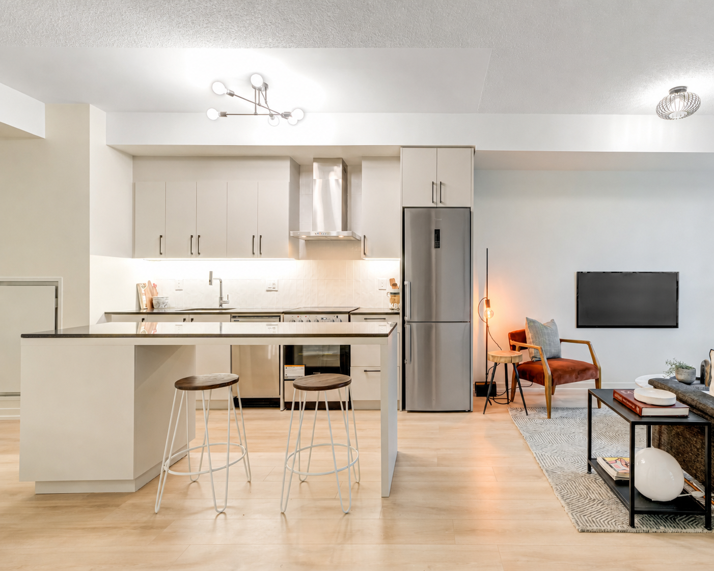 Kitchen with light matte cabinets after House of Wrap vinyl installation